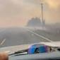 Video shows escape through flames and smoke as wildfire begins burning the outskirts of Idaho town