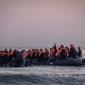 Dinghies at dawn and a determination to arrive: on the French coast waiting to cross to UK