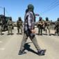Protesters and US federal agents clash during immigration raid at California farm – video