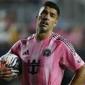 Suarez appears to spit at opposition coach after melee