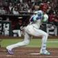 D-backs rally from early 4-run deficit and beat Giants 6-5 to keep pace in NL playoff race