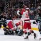 Carrier, Robinson score late in 2nd period and Hurricanes beat Sharks 5-1 to improve to 3-0