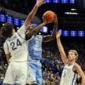Dixon delivers late as No. 16 North Carolina wins 67-64 at No. 18 Kentucky