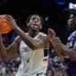 Tarris Reed Jr. has 31 points and 27 rebounds as No. 2 UConn beats Furman 82-71 in NCAA Tournament